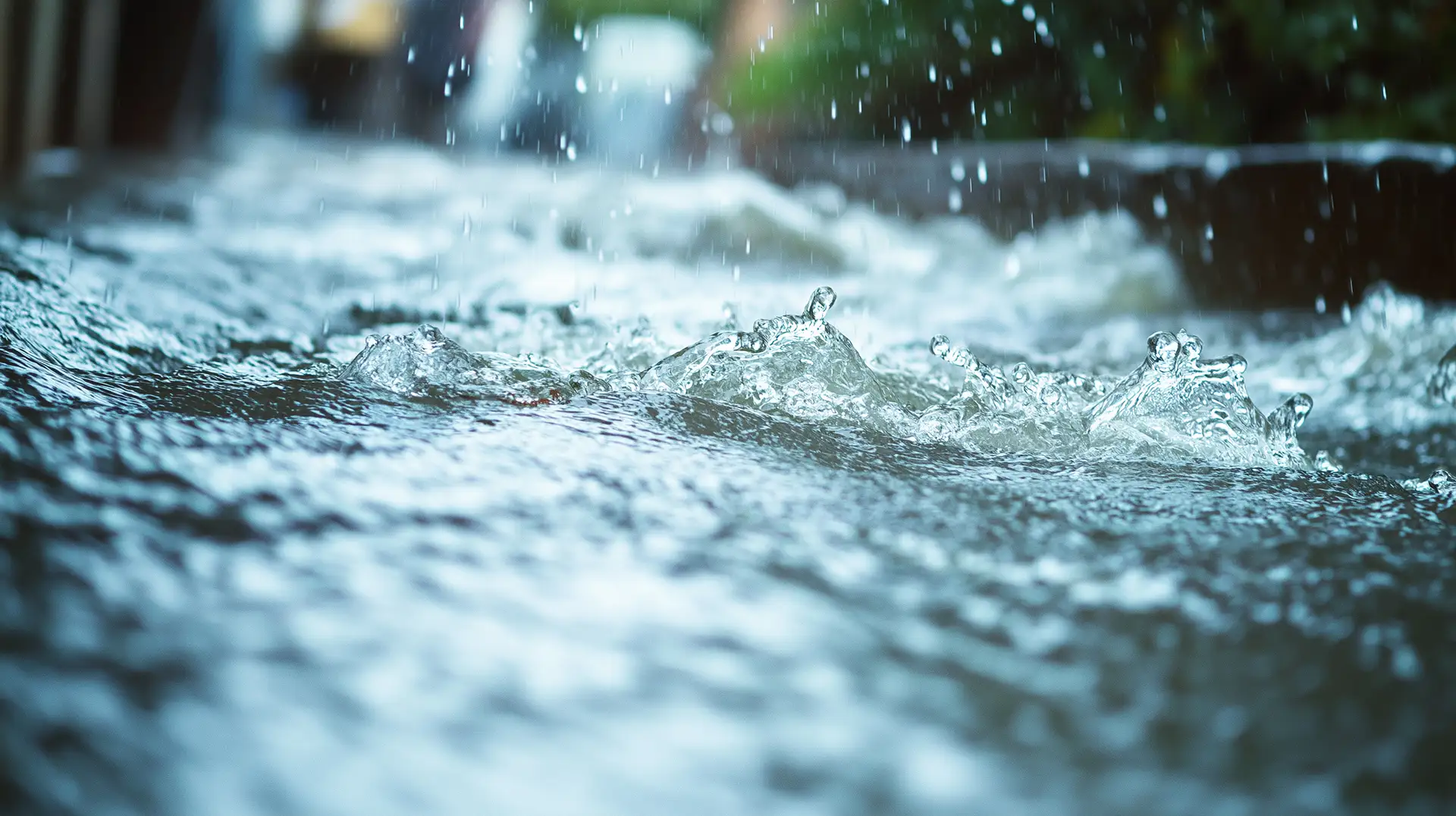 A close-up image of water splashing, illustrating the concept of "Flood vs Home Insurance".