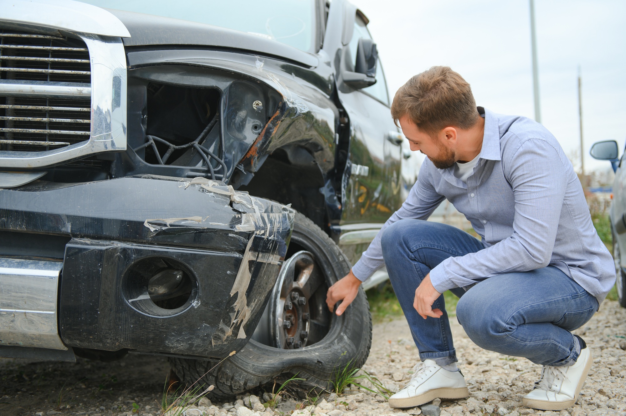Car accident. Man after car accident. Man regrets damage caused during car wreck