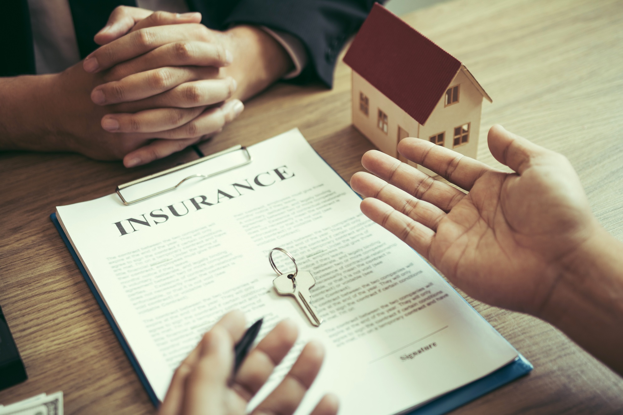 Customers buying houses are negotiating about the Rising Insurance Rates Solutions with agents.